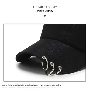 Detail of black baseball cap brim with three silver rings and sturdy sandwich structure