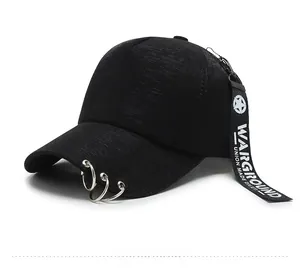Detail of street style black baseball cap with silver rings and long logo strap