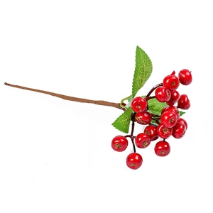 Artificial red berry branch with green leaves for Christmas and home holiday decoration