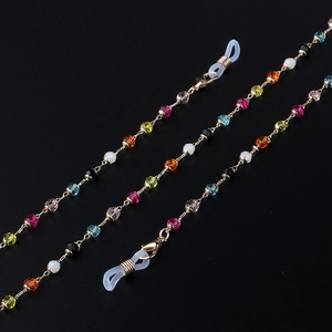 Chaîne à lunettes en cristal coloré avec maillons dorés et boucles en silicone antidérapantes