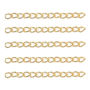Macro view of five adjustable gold metal extension chains for DIY jewelry making accessories