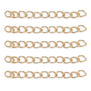 Detail view of five golden adjustable extension chains for DIY jewelry making and repair