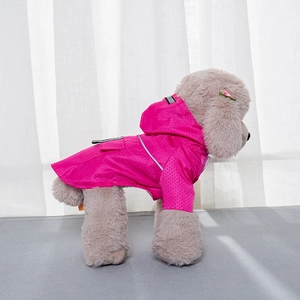 Macro detail of rose red waterproof honeycomb fabric and reflective safety strip on pet raincoat