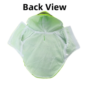 Inside view of green pet raincoat featuring breathable white mesh lining and hood