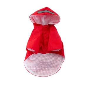 Close-up of red pet raincoat featuring reflective safety strip and breathable mesh lining