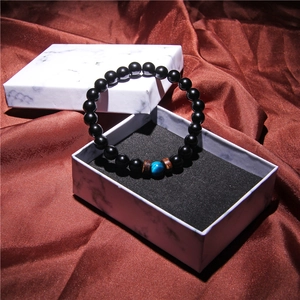 Mens beaded bracelet with blue gemstone and lava stones in a marble gift box