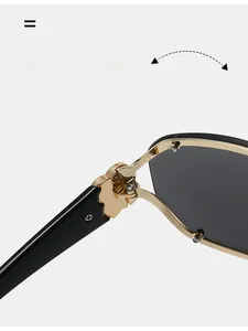 Close-up of durable golden metal hinge on black oversized fashion sunglasses frame