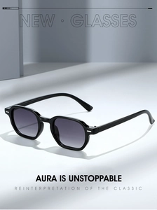 Detailed close-up of stylish black polygon sunglasses with gradient lenses and metal hinges