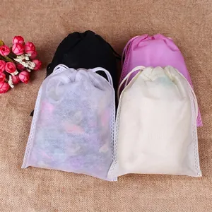 Set of four non-woven drawstring bags in black, pink and white for storage and dust protection