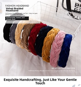 Close-up of velvet braided headbands in various colors displayed in a white wire basket
