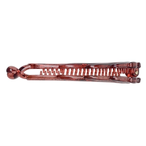 Close-up of brown resin banana hair clip with durable teeth and metal spring detail