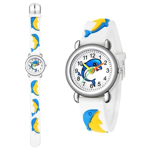 Detail of white silicone kids watch featuring blue 3D cartoon dolphin relief patterns