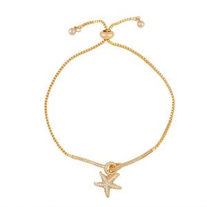 Adjustable gold starfish bracelet with sparkling zircon crystals and a sliding clasp closure