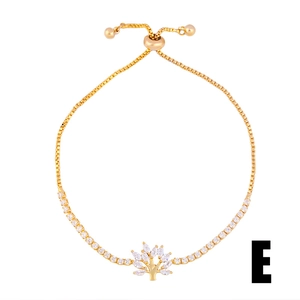 Detailed view of adjustable gold tree of life bracelet with cubic zirconia on box chain