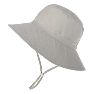 Detail of light beige sun hat with wide brim, reinforced stitching and adjustable drawstring