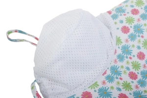 Detail of breathable white mesh crown and floral daisy pattern brim on kids sun hat