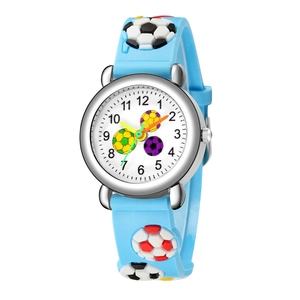 Detailed view of kids sports watch featuring 3D soccer relief on blue silicone strap
