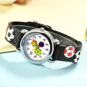 Detailed view of kids sports watch with 3D embossed football pattern on black silicone strap