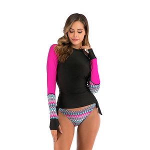 Detail of long sleeve rash guard set with black bodice and neon pink printed sleeves