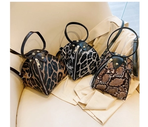 Three leopard and snake print triangular PU leather mini handbags with top handles and straps