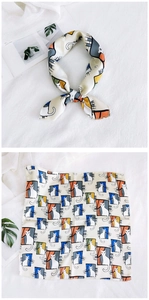 Detailed view of the cat print scarf showing knotted styling and full pattern layout