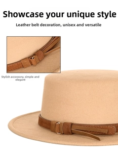 Detail of camel wool felt boater hat featuring a brown suede belt with metal buckle