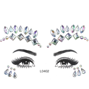 Detailed placement of holographic AB resin face jewels on eye and forehead outlines
