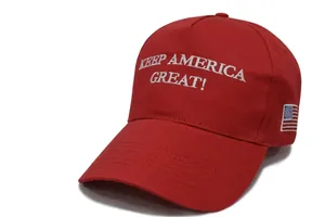 Detail of red cotton baseball cap with white embroidery and American flag on the side
