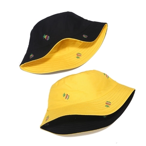 Double-sided cotton bucket hat with pineapple embroidery in black and yellow colors