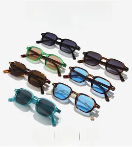 Close-up of thick-frame sunglasses in various colors like tortoise and transparent green