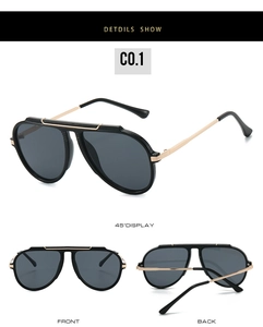 Detail view of pilot sunglasses with gold metal bridge and dark grey lenses in black frame