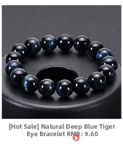 Macro shot of deep blue tiger eye beads bracelet showing natural cat eye effect luster