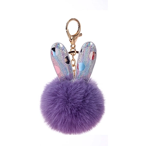 Purple faux fur pom pom keychain with glitter bunny ears and golden metal hook