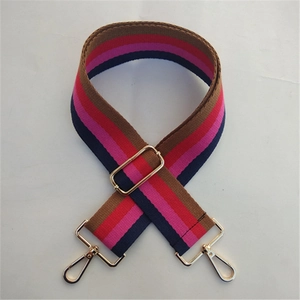 Adjustable striped strap for handbags with gold-tone hooks and metal buckle detail