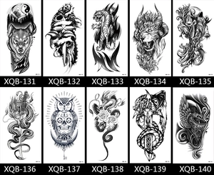 Grid display of black and white temporary tattoo stickers featuring wolf, tiger and dragon