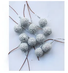 Detail of silver glitter berries with flexible wire stems for Christmas DIY crafts
