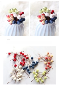Detail of artificial blueberry branches with flexible wire core for home floral decor