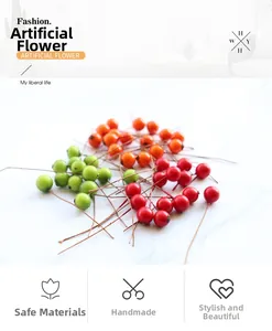 Detailed close-up of artificial small berries in red, green, and orange for DIY decor