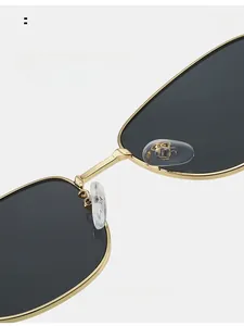 Detail of comfortable silicone nose pads on gold metal sunglasses frame for easy wear