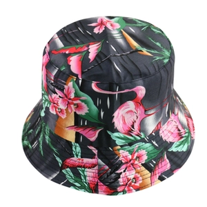 Detailed view of women's bucket hat featuring vibrant floral and flamingo prints