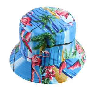 Detailed view of women's reversible bucket hat with tropical flamingo and palm tree print
