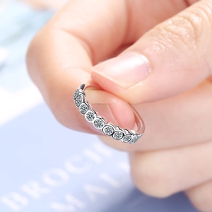 Elegant silver open ring with single row of sparkling diamonds for women