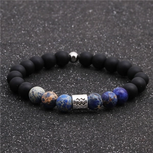 Macro detail of Aquarius zodiac beaded bracelet with matte black and emperor stone beads