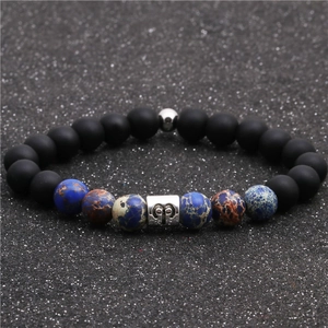 Detail view of beaded Aries zodiac bracelet with matte black stone and imperial jasper