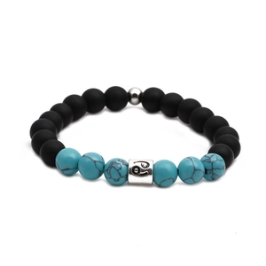 Zodiac couple bracelet with matte black beads, turquoise stones, and silver Cancer charm