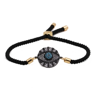 Adjustable black woven evil eye bracelet with blue zircon and golden accents