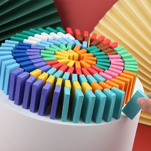 Colorful wooden domino blocks set in a spiral rainbow pattern for educational play