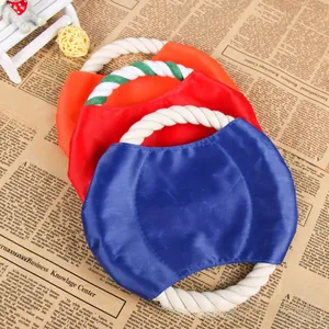 Detail of durable canvas dog frisbees with thick woven cotton rope handles in three colors