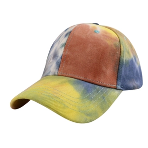 Detail of colorful tie-dye baseball cap featuring cotton twill texture and curved brim