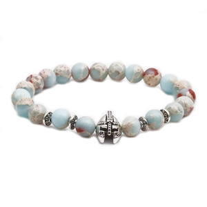 Detail of beaded bracelet featuring natural stone beads and silver Spartan helmet charm